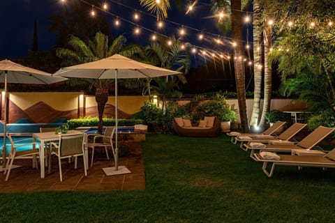 Unwind by the illuminated pool and garden. Perfect for warm, starlit nights.