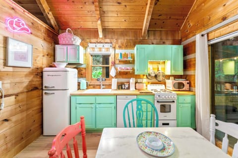 Fully equipped retro-inspired kitchen with cheerful pops of color!