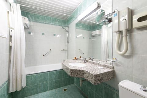 Combined shower/tub, designer toiletries, hair dryer, bathrobes