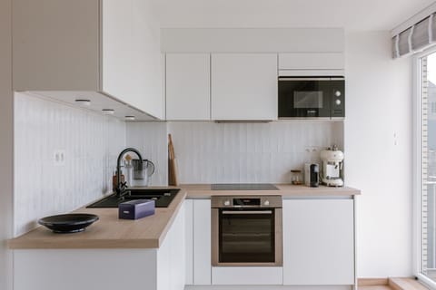 Modern white kitchen with oven