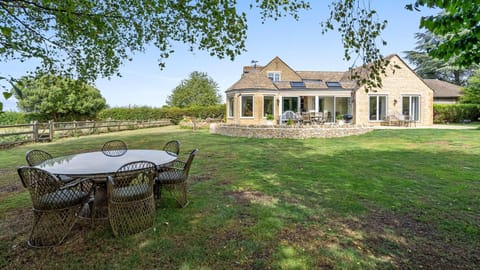 The garden is sprawling with lots of room for the children to play.