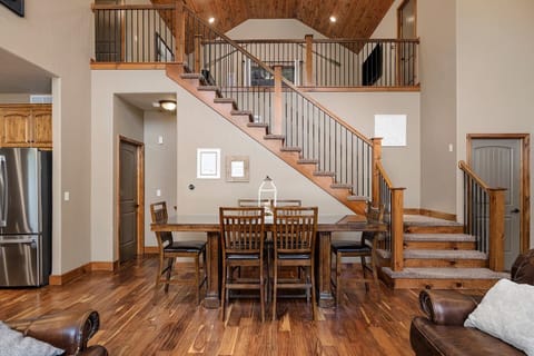 Large dining table with seating for 10, 4 more at the island, and a small dining table with seating for 3 for 17 total