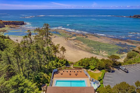With picturesque views of the sandy beach and rocky shoreline, the pool area offers a relaxing retreat in a scenic natural setting.