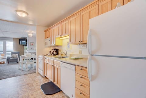 This inviting kitchen is equipped with modern appliances, offering convenience for preparing meals.