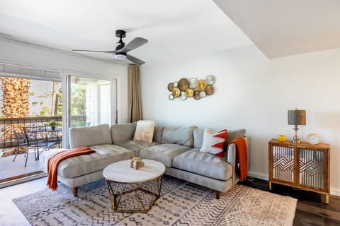 Bright living room with sectional and stylish decor.