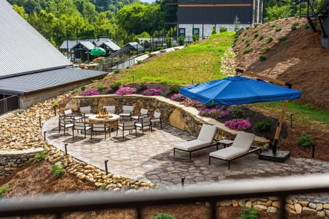 A welcoming outdoor space centered around a glowing fire pit with plenty of seating. Perfect for relaxing evenings, this area invites guests to enjoy warmth, great company, and beautiful surroundings while making lasting memories together.
