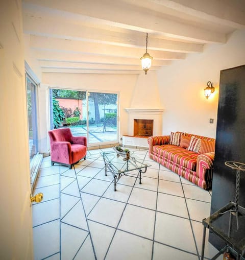 Deluxe Suite, Garden View | Living area | 30-inch Smart TV with cable channels