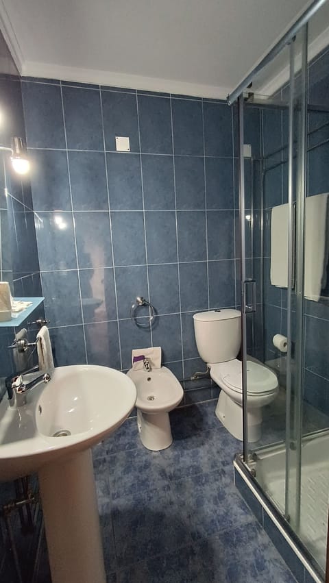 Triple Room, Balcony | Bathroom | Shower, free toiletries, towels