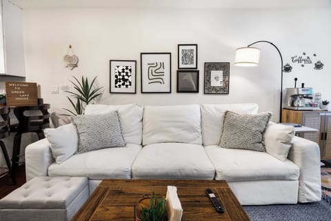 Cozy living room with a comfy sofa, chic artwork, and a coffee bar to start your mornings.