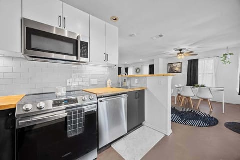 The kitchen feels like the heart of the home, a perfect balance of modern functionality and cozy charm.