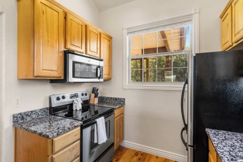 The inviting kitchen offers ample space & all the comforts of home