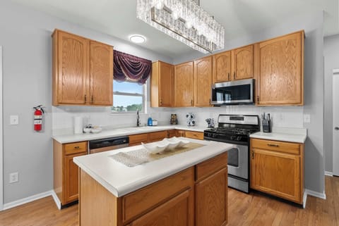 The airy kitchen offers ample space & all the comforts of home