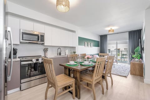 Dine at a stylish table for 6, enjoy balcony views & in-unit laundry.