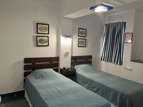 Standard Twin Room, 2 Twin Beds | In-room safe, desk, iron/ironing board, free cribs/infant beds