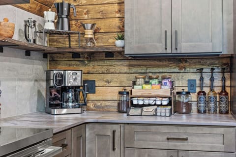 Fully stocked coffee and tea bar, with coffeepot, espresso maker, Keurig, pour over and french press