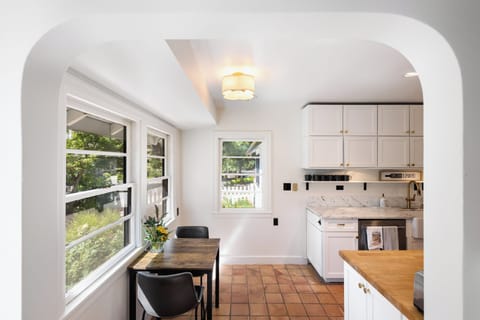 Ample storage space and a cozy eat-in table for meals or work.