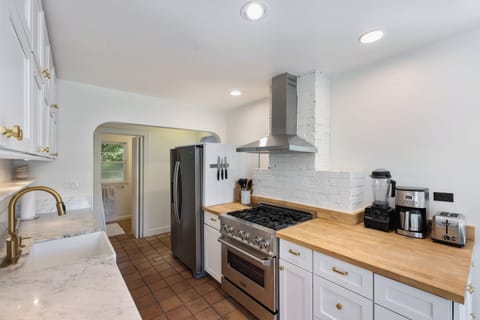 Stainless steel appliances plus essentials like blender, coffee maker, toaster.