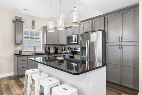 Sip morning coffee or grab a bite at the kitchen counter, seating 4