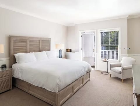 Unwind in crisp linens and sunlit comfort after exploring.