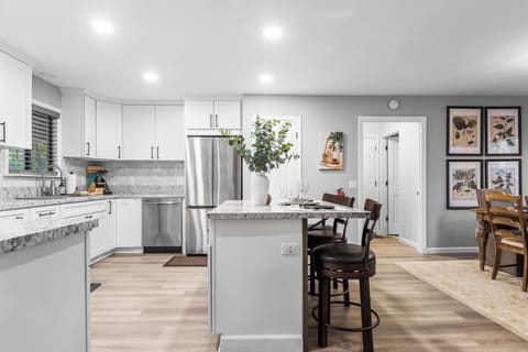 Kitchen with island and bar seating.