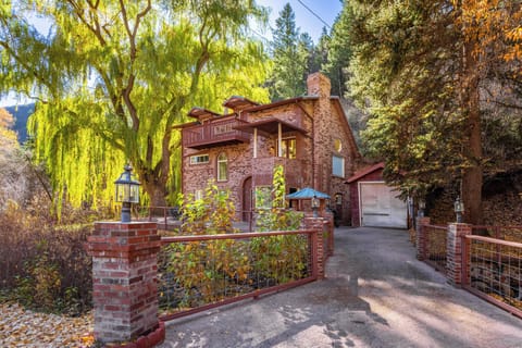 Fall view of bridge leading to house, garage is not available to guests