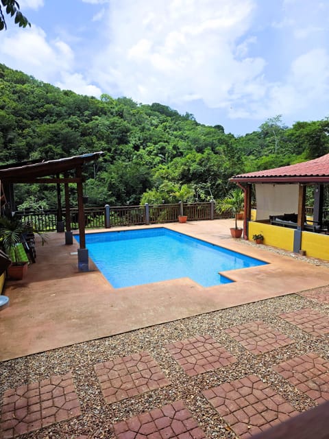 Your refreshing escape awaits! Dive into the shared pool with stunning views.