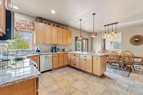Kitchen: Main floor, drip coffee maker, French press, toaster, cooking utensils, tableware