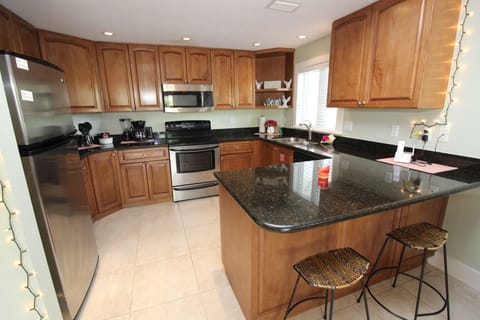 Deluxe Condo, 2 Bedrooms | Private kitchen | Microwave, coffee/tea maker, cookware/dishes/utensils