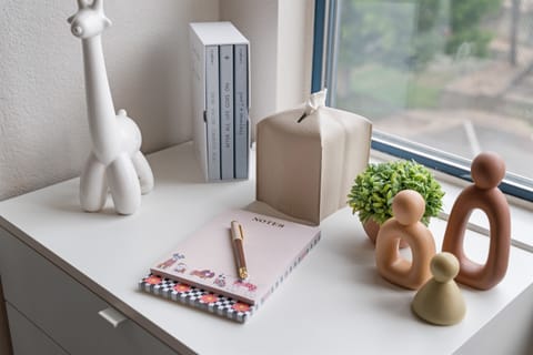 Bedroom 2 with thoughtfully designed decor, lots of light, but black out blinds, and bedroom storage.