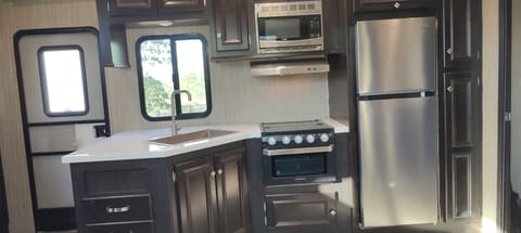 Microwave, 3 burner stove/oven with Fridge/ freezer