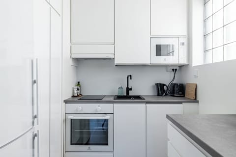 Deluxe Apartment, Balcony | Private kitchen | Coffee/tea maker, toaster, spices, cleaning supplies