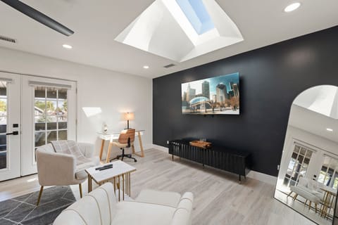 skylight windows bring in natural light making the room bright and airy