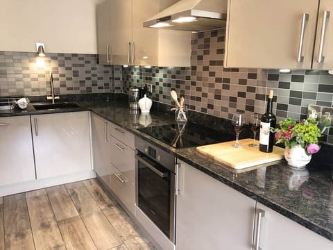 Lovely clean kitchen with new appliances, utensils and crockery