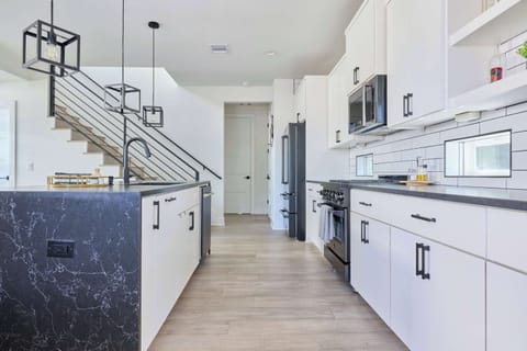 The fully-equipped kitchen is stocked to whip up home-cooked meals, from morning coffee to evening dinners.