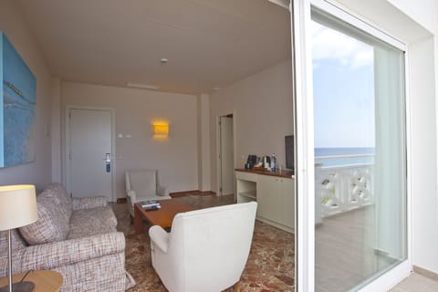 Suite, Sea View | Living room | Flat-screen TV