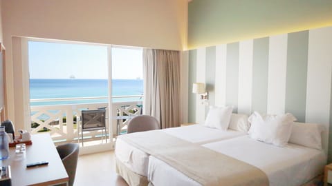 Double Room, Balcony, Sea View | Minibar, in-room safe, desk, blackout drapes