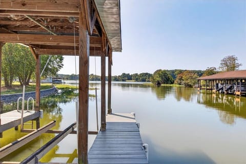 Peaceful waters stretch out from the boathouse.