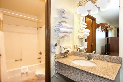 Combined shower/tub, hair dryer, towels, soap