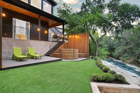 Creekside backyard with a heated pool