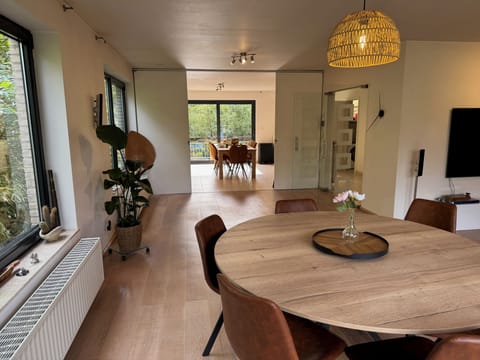 Open kitchen to dining area with sliding doors for optional privacy