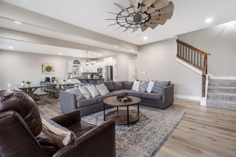 Main floor living room with access to the upper level