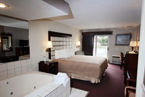 Suite, 1 King Bed, Jetted Tub | Pillowtop beds, in-room safe, desk, blackout drapes