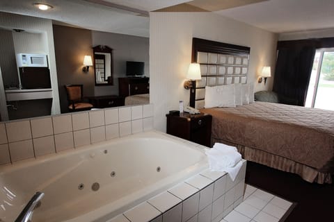 Suite, 1 King Bed, Jetted Tub | Pillowtop beds, in-room safe, desk, blackout drapes