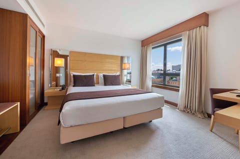 Deluxe Suite, City View | Minibar, in-room safe, desk, laptop workspace