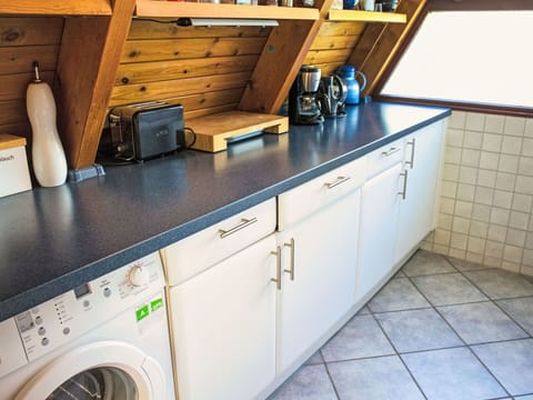 Wood, Kitchen, Flooring, Countertop, Plumbing Fixture, Interior Design, Cabinetry, Floor, Kitchen Sink, Kitchen Appliance