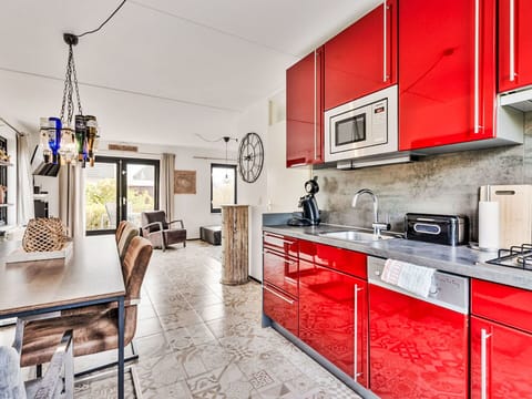 Furniture, Kitchen, Interior Design, Flooring, Floor, Ceiling, Countertop, Apartment, Lighting, Cabinetry