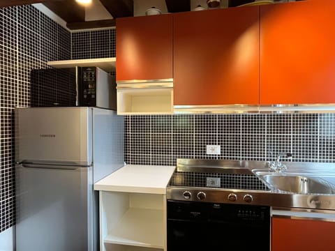 Kitchen, Kitchen Appliance, Countertop, Major Appliance, Interior Design, Cabinetry, Flooring, Kitchen Stove, Kitchen Sink, Lighting