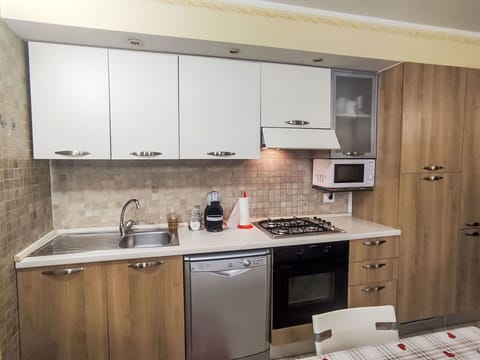 Kitchen, Kitchen Appliance, Countertop, Major Appliance, Cabinetry, Wood, Kitchen Stove, Stove, Furniture, Kitchen Sink