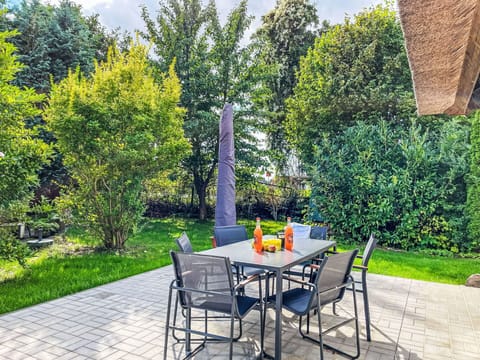 Furniture, Outdoor Furniture, Chair, Outdoor Table, Table, Shrub, Garden, Land Lot, Shade, Kitchen & Dining Room Table