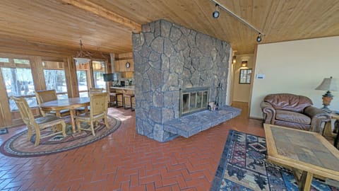 The hall past the fireplace takes you to the Kitchen, pantry, hall bath and Bedroom